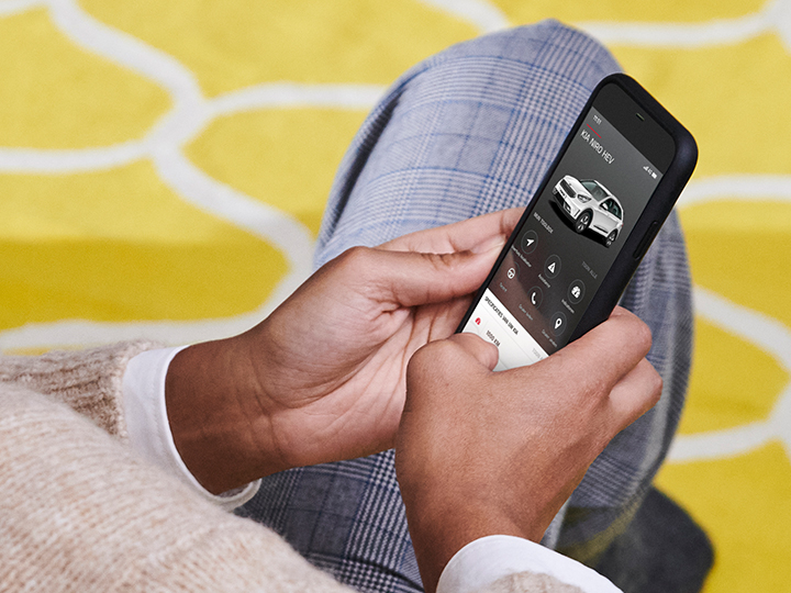 Customer in home environment exploring the MyKia app